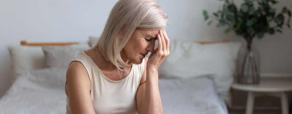 Older Woman Suffering from Menopause Symptoms