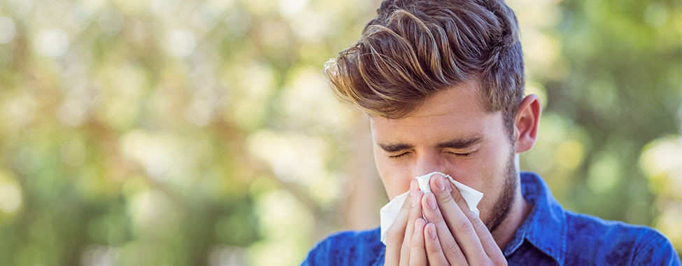 Man Sneezing from Allergy Symptoms