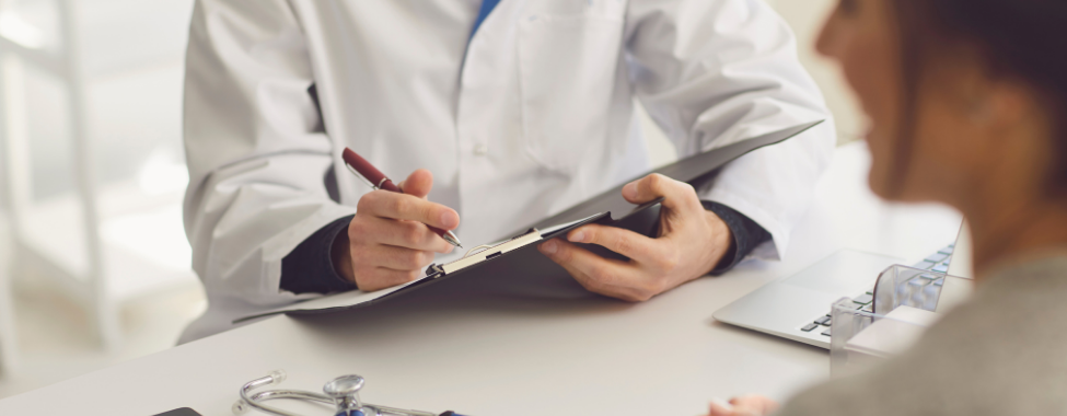 Person-Discussing-Health-Insurance-with-Doctor