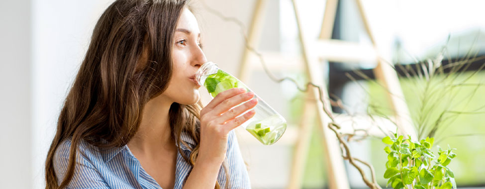 Woman Drinking Water the Hydrate in Hot Weather