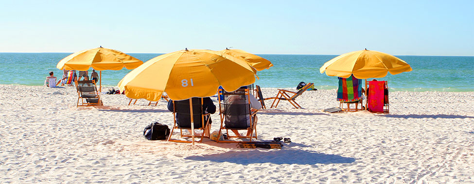 Umbrellas Over Beach Chairs for Shade from Heat