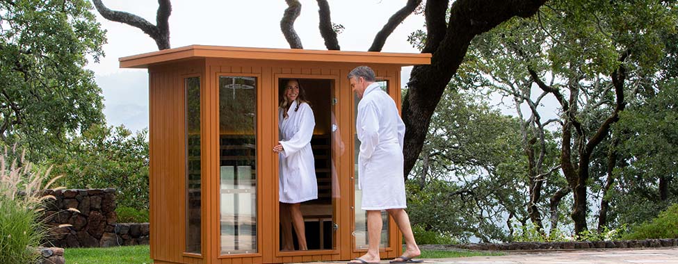 Couple Using Outdoor Infrared Sauna at Home