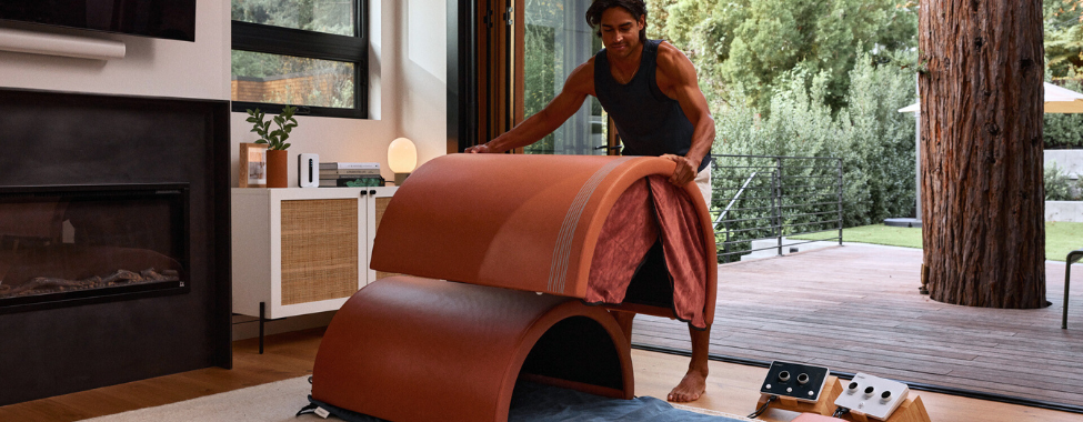 Man Setting Up Curve Infrared Sauna Dome for Mental Health
