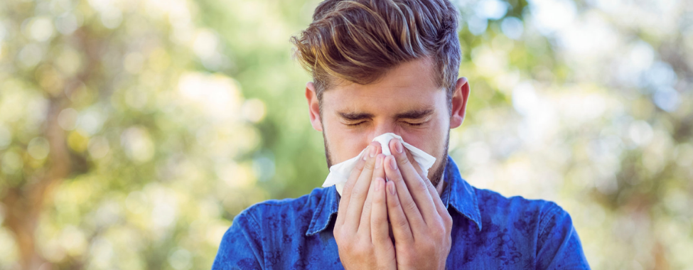 Man Sneezing from Allergy Symptoms