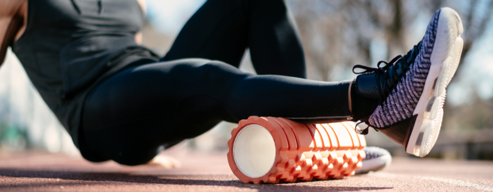 Man Foam Rolling for Muscle Pain Relief