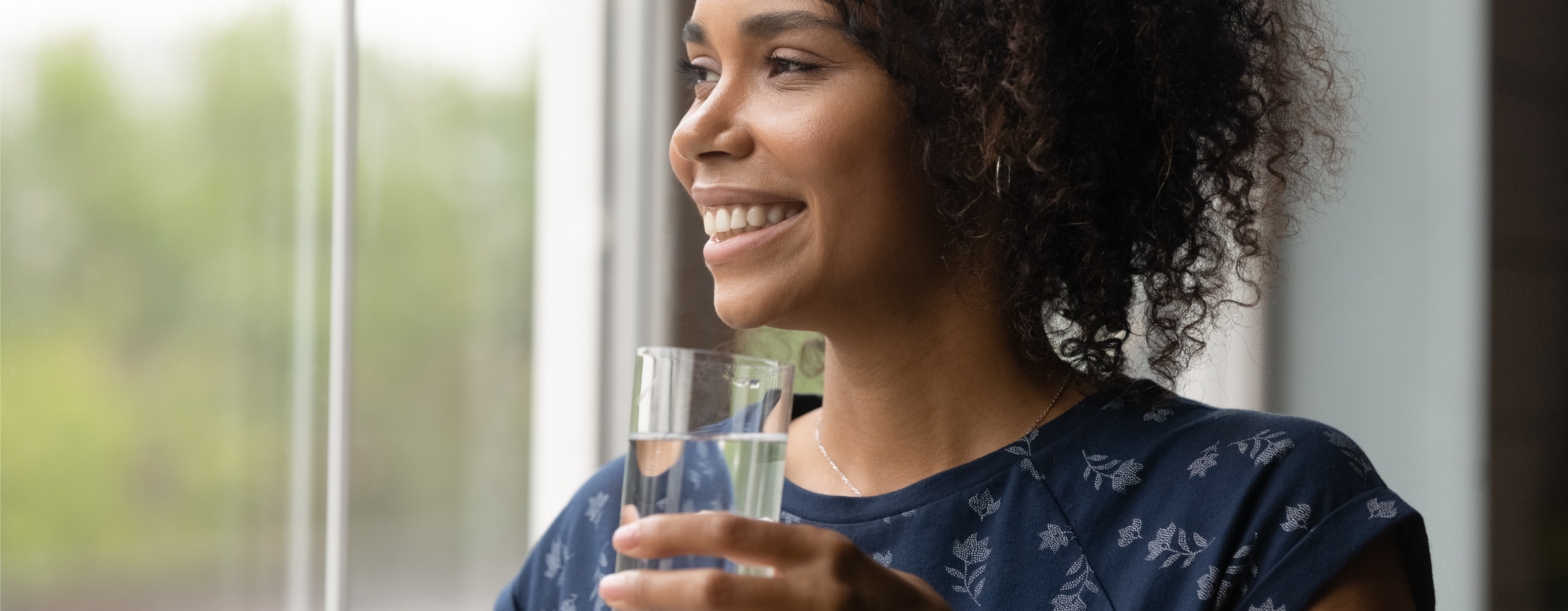 Refreshed Woman Drinking Water to Stay Hydrated