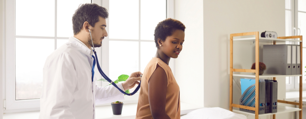 Doctor Checking Patient for Respiratory Issues from Pollution