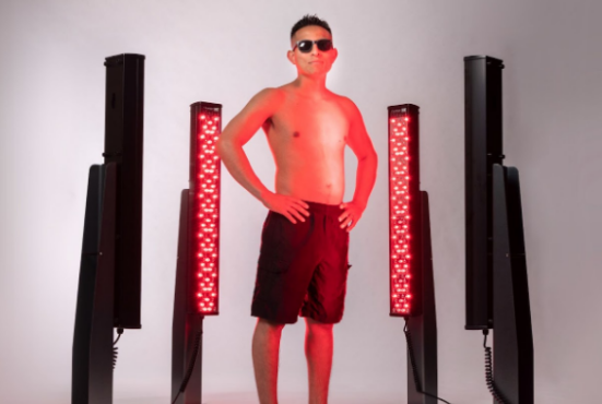 Man in front of Clearlight Red bars