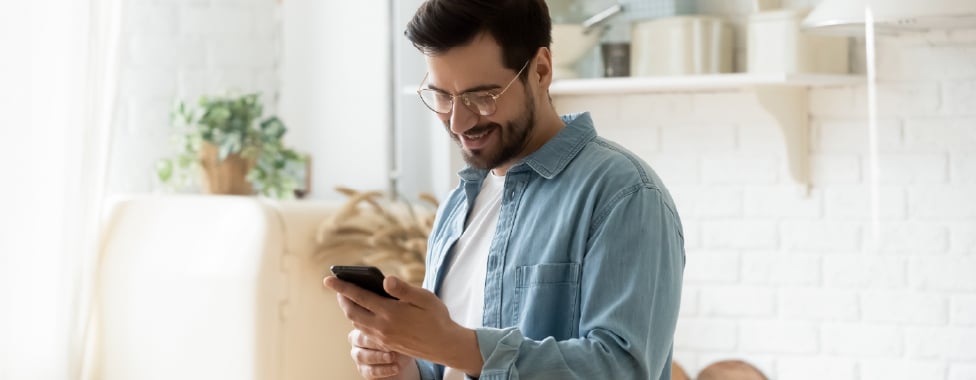 Man Reading Health and Wellness Blog on Phone