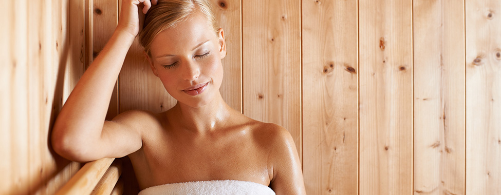 Woman Relaxing in Infrared Sauna During Daily Routine