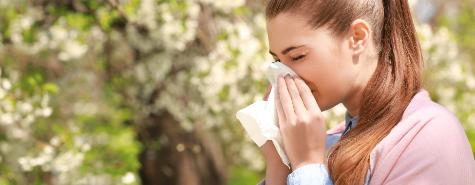 Woman Dealing with Spring Allergies and Sneezing