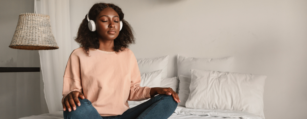 Woman Practicing Meditation Before Bed