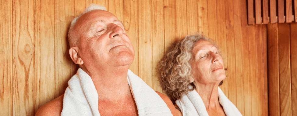 Older Couple Sitting in Infrared Sauna