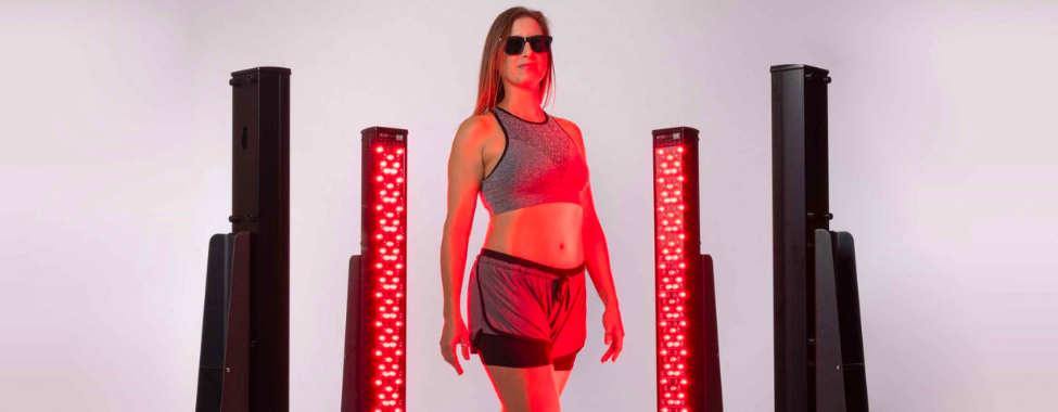 Woman Using Clearlight® Red Light Therapy Device