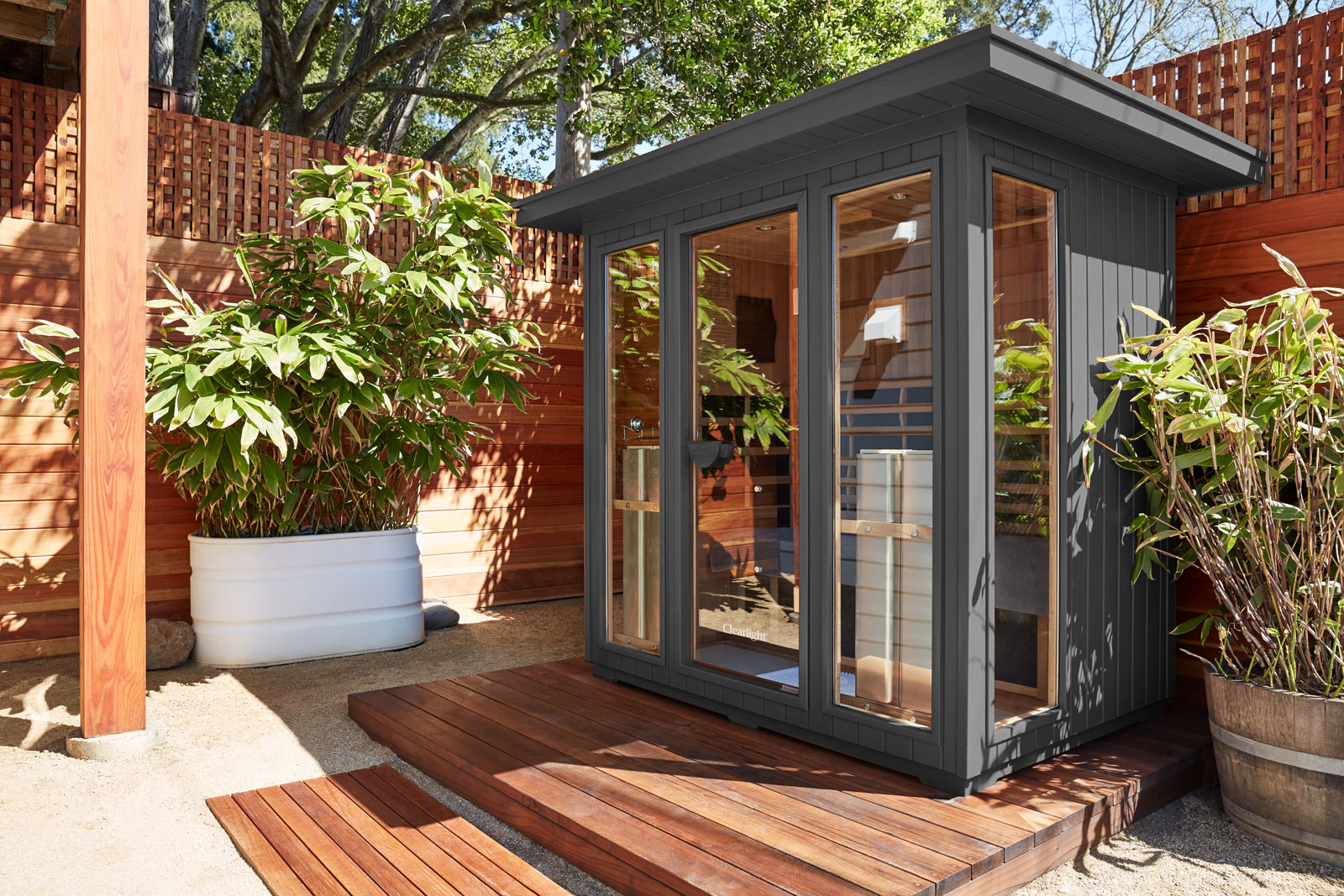Clearlight Sanctuary Outdoor 5 Infrared Sauna in a backyard