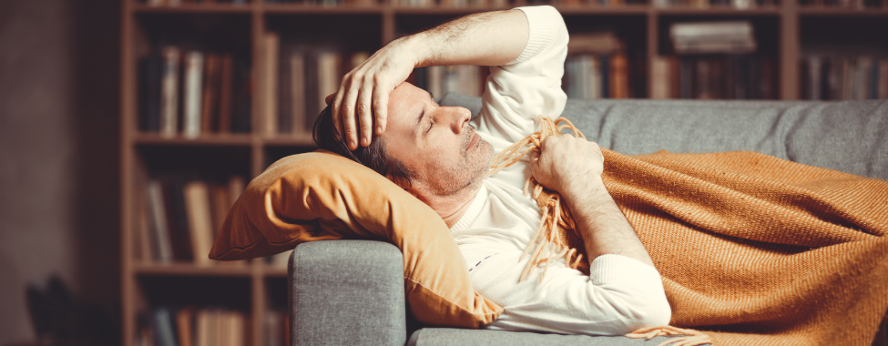 Man on Couch Recovering from Flu