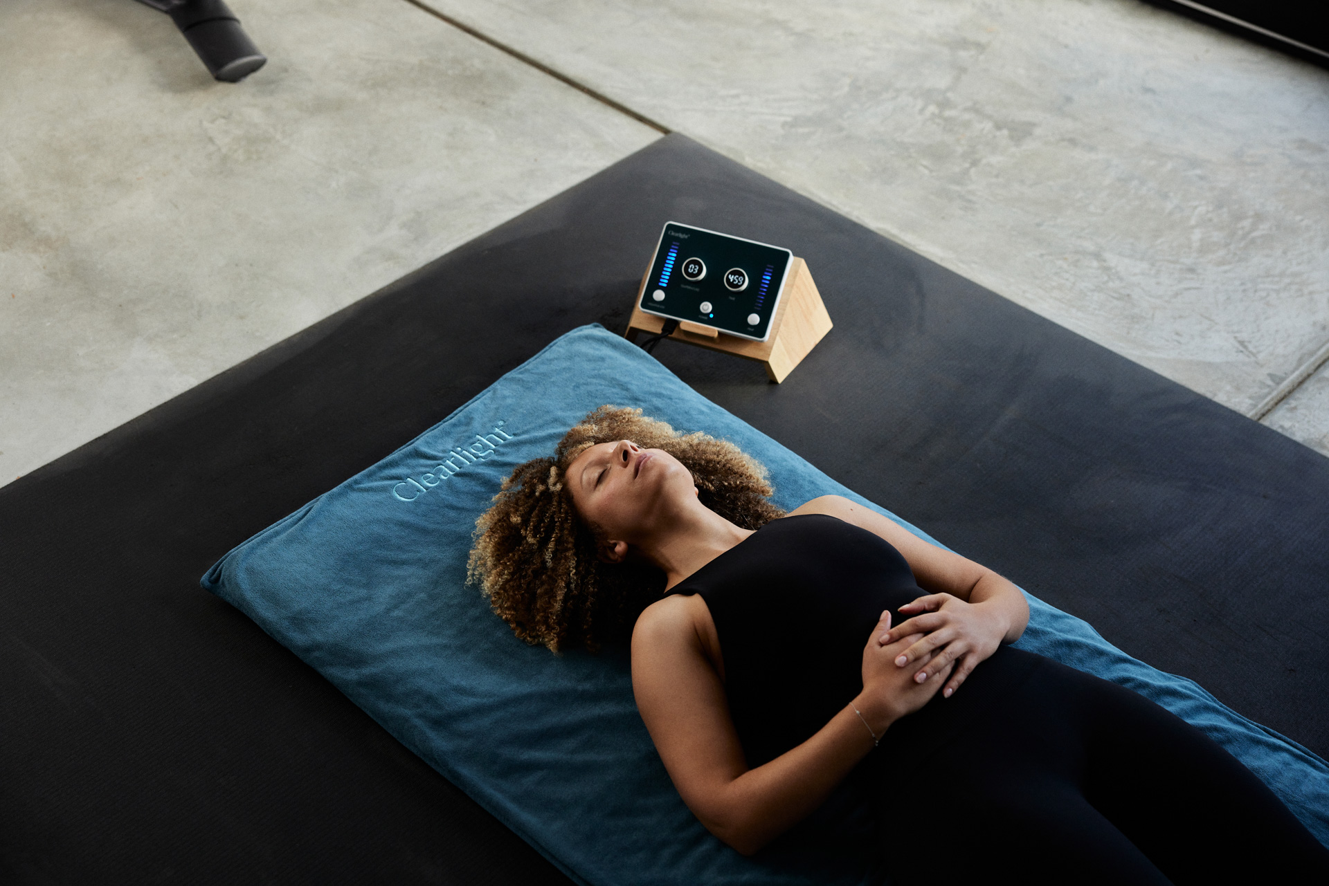 Woman laying down on mat