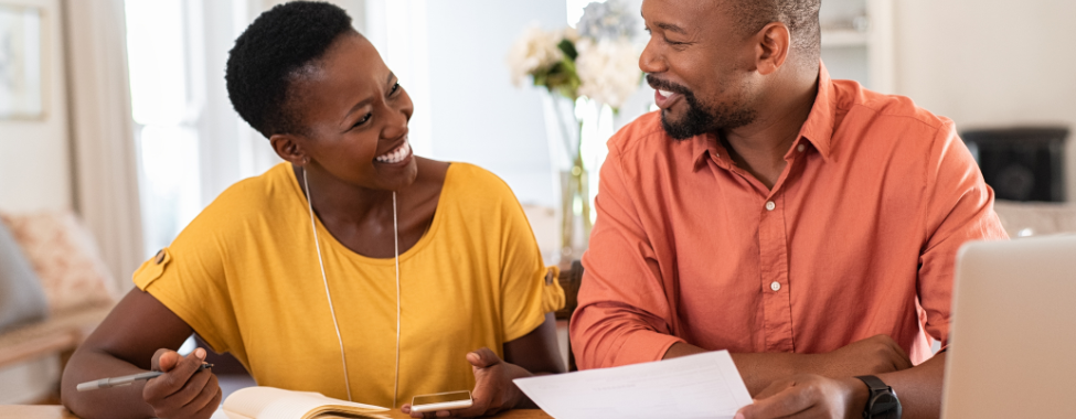 Happy Couple Making Savings Plan to Buy an Infrared Sauna