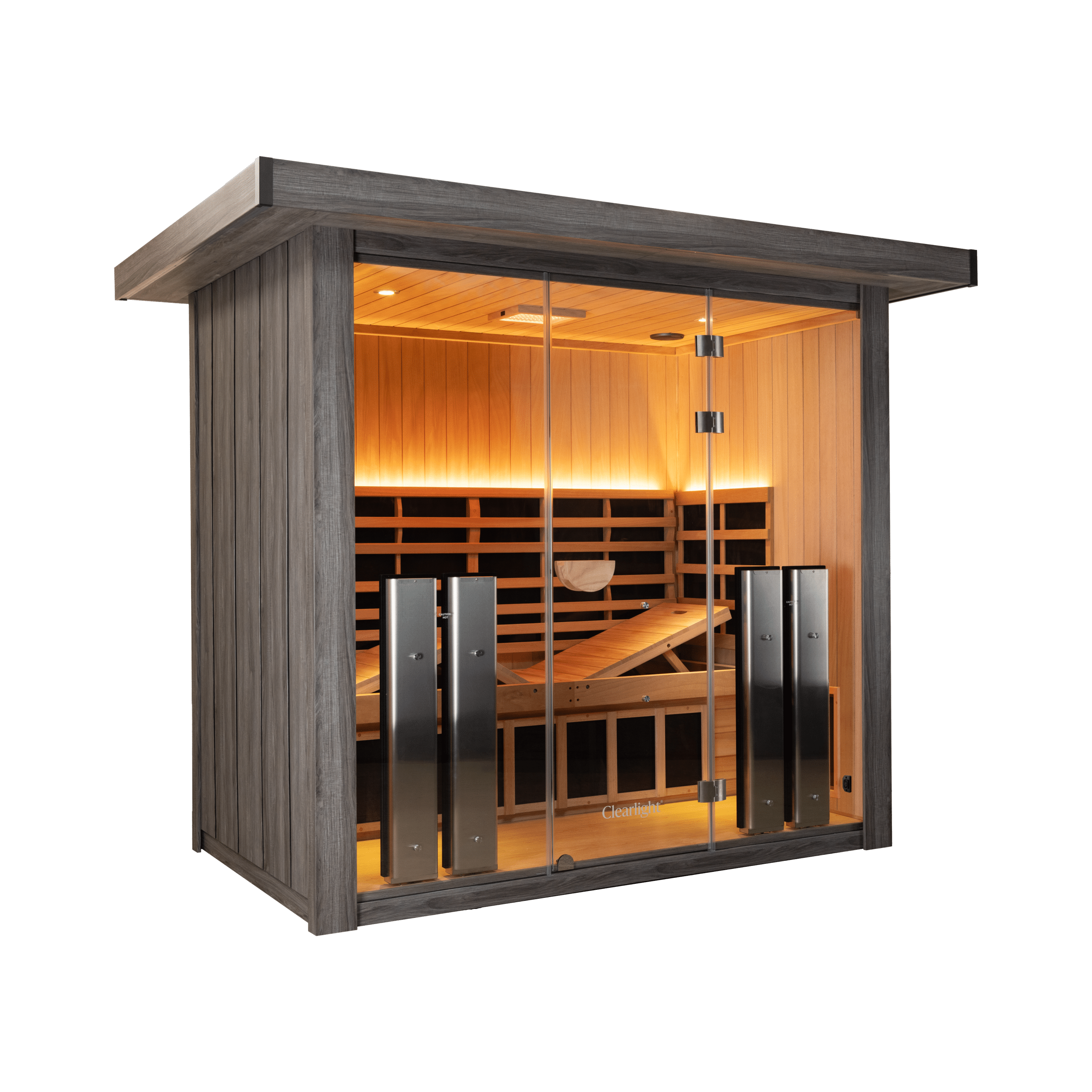 Wood-clad sauna room with glass doors, warm interior lighting and wooden benches visible through the entrance.
