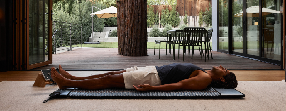 Man Using Clearlight PEMF Mat to Regulate Nervous System