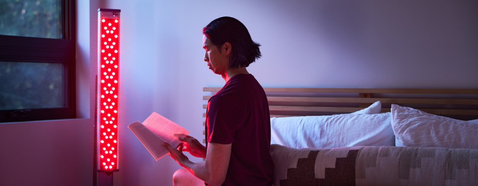 Man Using Clearlight Red Light Tower Before Bed