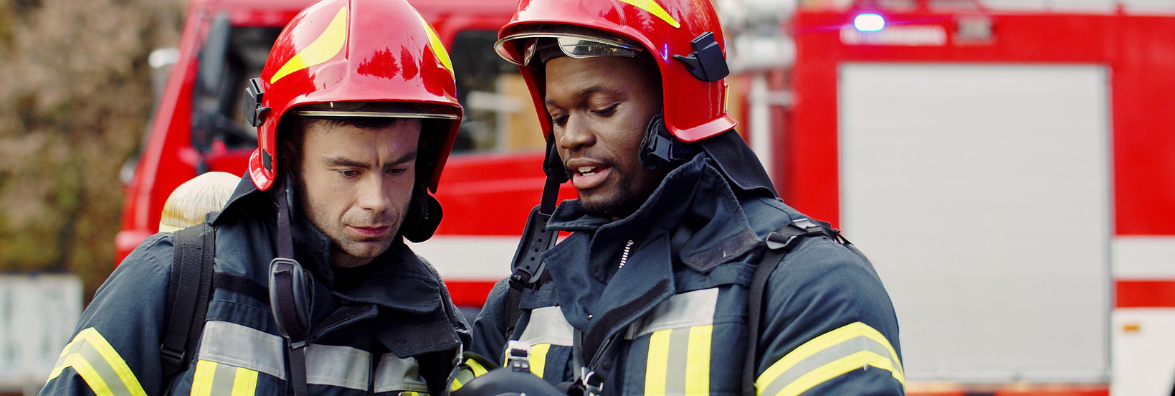 Two Firefighters Speaking While on Duty