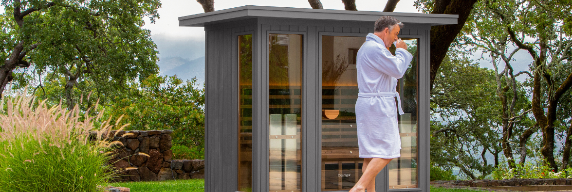 Man Walking to Use Outdoor Infrared Sauna by Clearlight