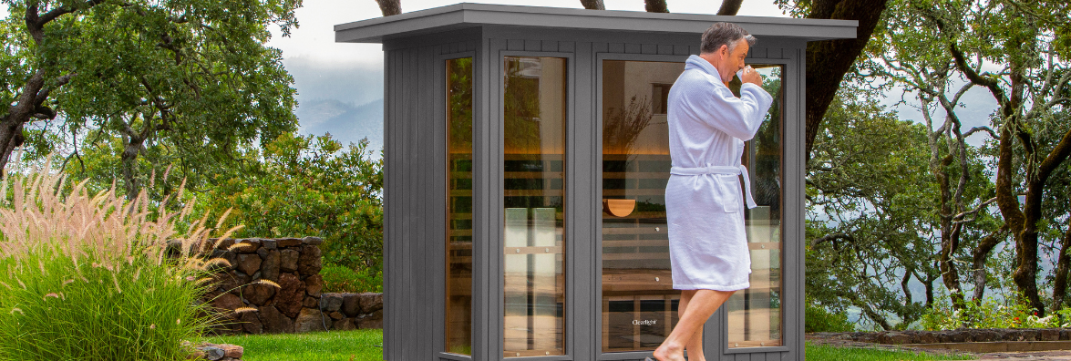 Man Using Clearlight Outdoor Infrared Sauna at Wellness Retreat