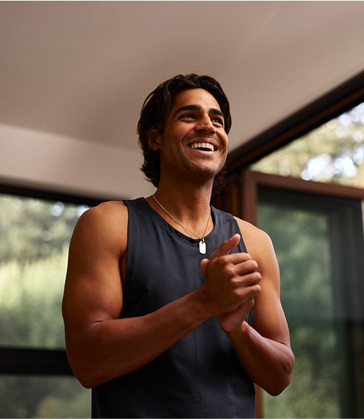 Young happy man clapping his hands