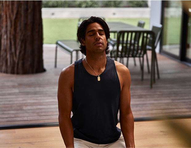 Man doing deep breathing exercises to reduce stress