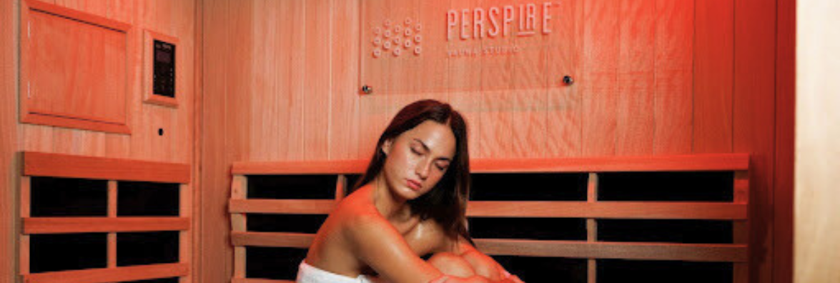 Woman Using Red Light Therapy in Clearlight Sauna at Perspire Sauna Studio