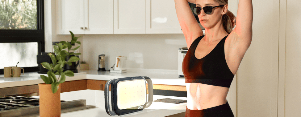 Woman Using Clearlight SUN ONE® Wellness Lamp for Vitamin D